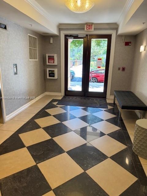 A lobby features a black and white checkered floor, glass doors, and a black bench — 1919 Van Buren St # 516A, Hollywood FL 33020, HOLLYWOOD, FL