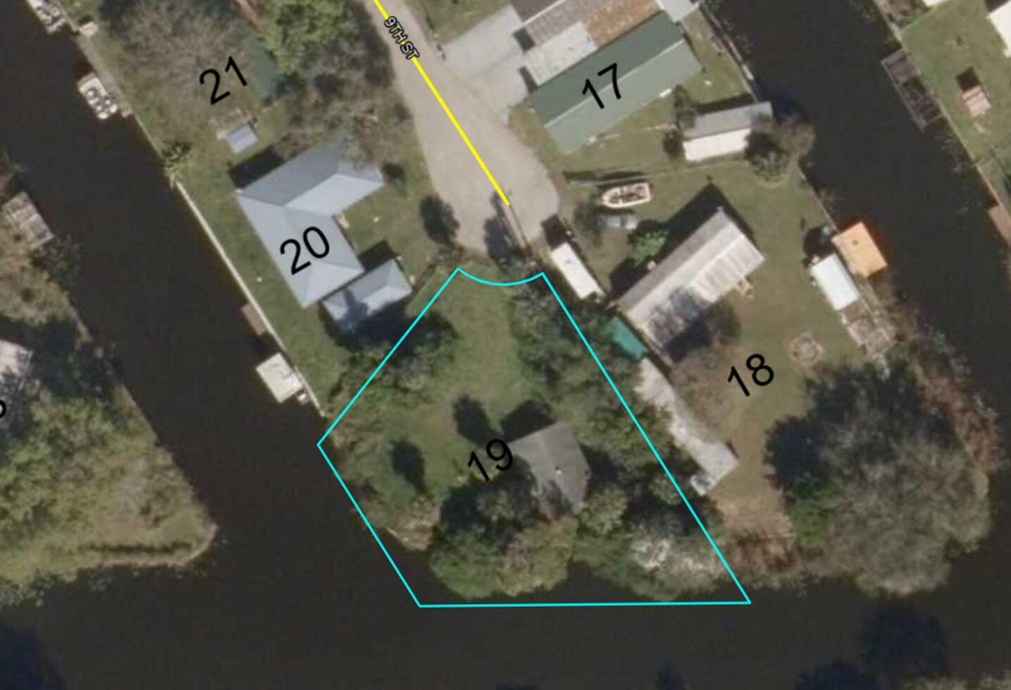 An aerial map view shows a residential property lot outlined in blue near a canal — 1244 9th Street, Okeechobee FL 34974, OKEECHOBEE, FL