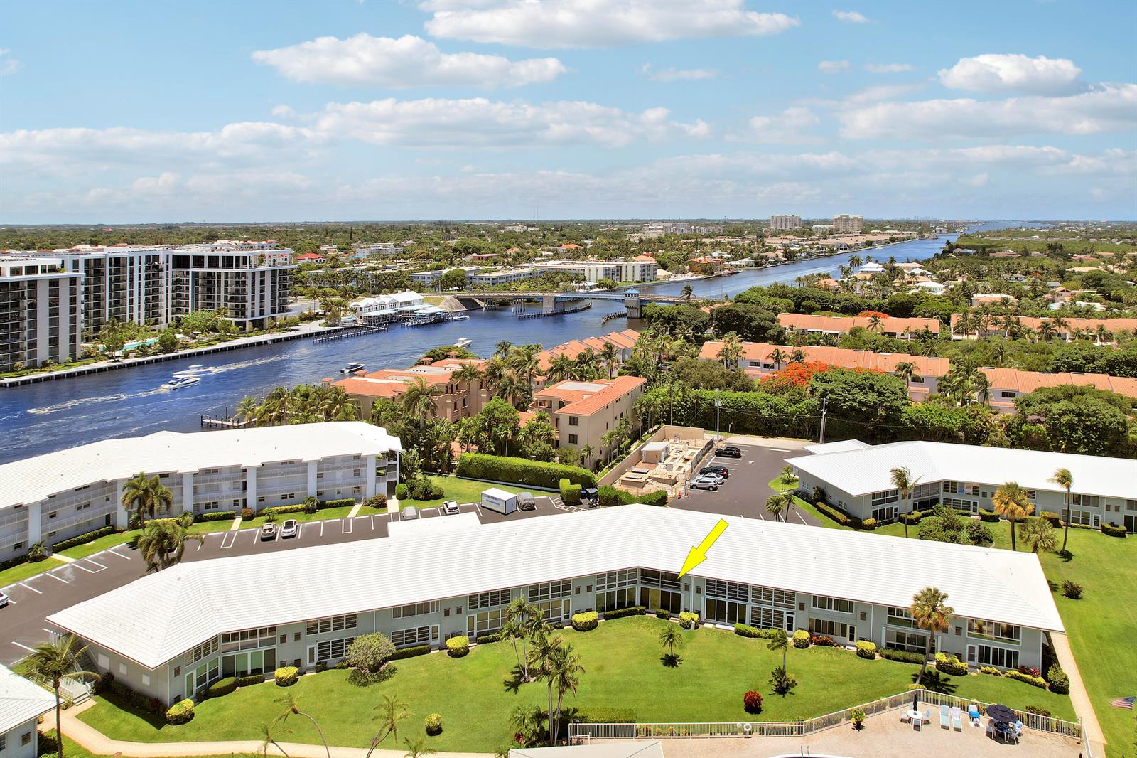 An aerial view shows a low-rise apartment building with a white roof and green lawn — 5540 N Ocean Boulevard # 206, Ocean Ridge FL 33435, OCEAN RIDGE, FL