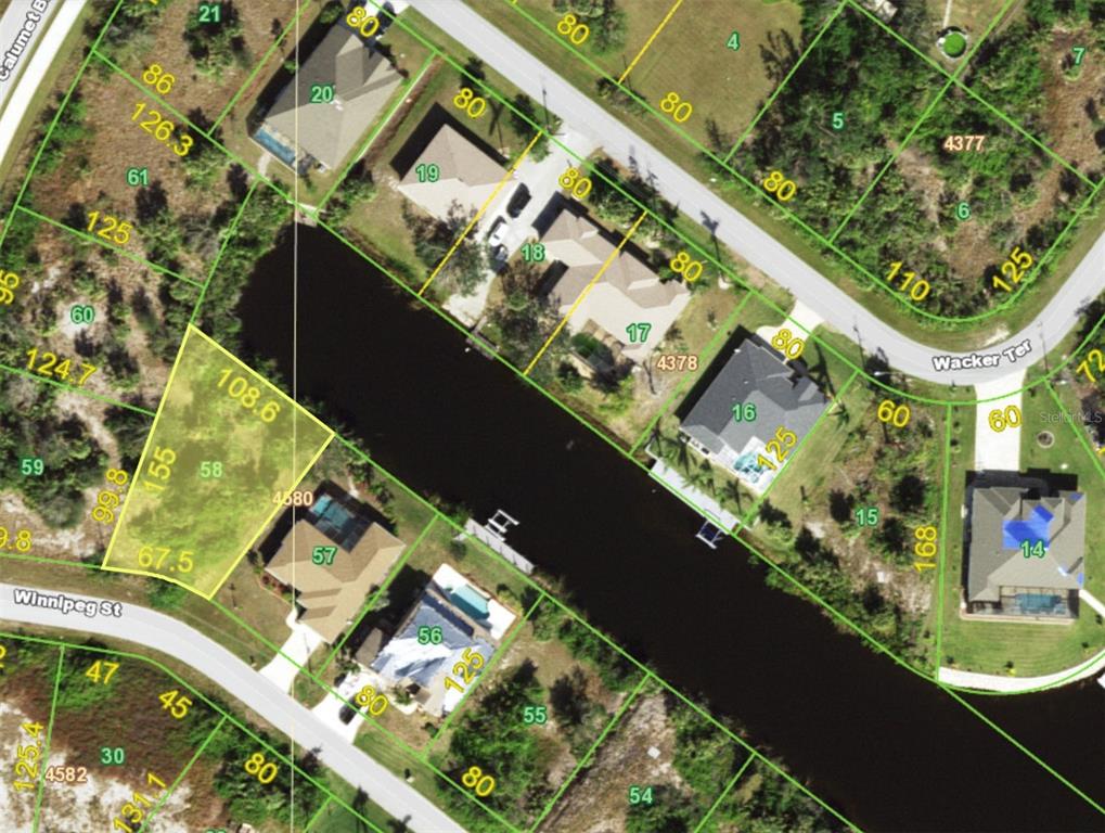 This is an aerial map showing residential lots and a canal in a neighborhood — 9864 WINNIPEG STREET, PORT CHARLOTTE, FL
