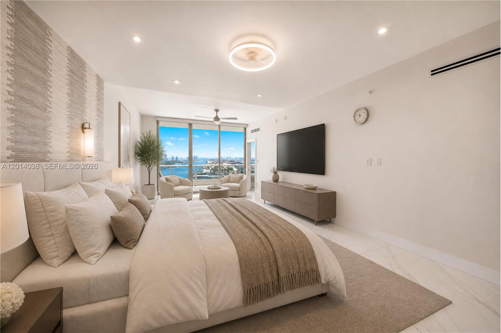 A modern bedroom features a king bed, a wall-mounted television, and floor-to-ceiling balcony windows — 900 Biscayne Blvd # 4202, Miami FL 33132, MIAMI, FL