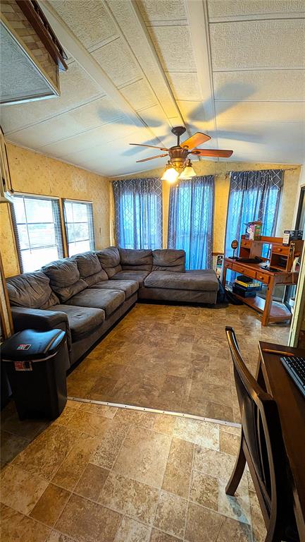 A living room features a large gray sectional sofa, tile flooring, and a ceiling fan — 3000 CLARCONA ROAD UNIT 520, APOPKA, FL