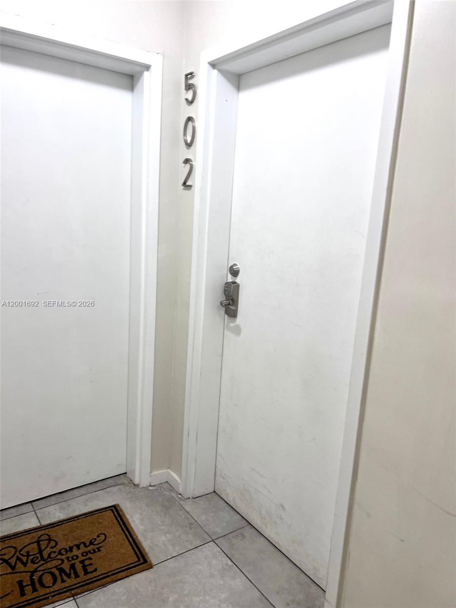 A hallway features two white doors, one marked with the number 502 — 481 NE 29th St # 502, Miami FL 33137, MIAMI, FL