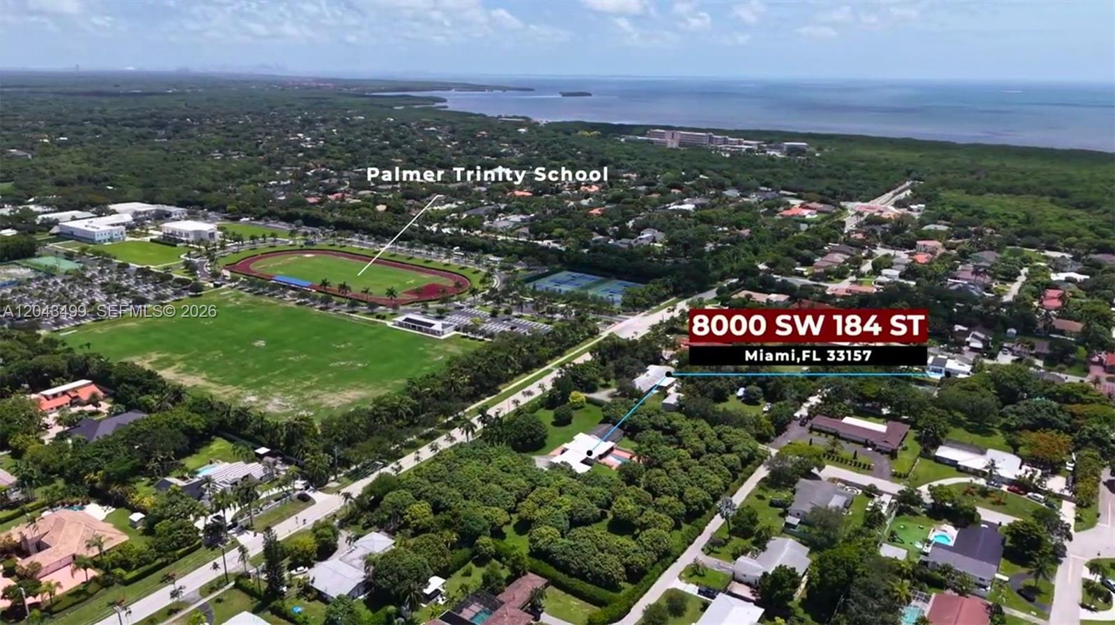 An aerial view shows a residential property located near a large school with athletic fields — 8000 SW 184th St, Cutler Bay FL 33157, CUTLER BAY, FL