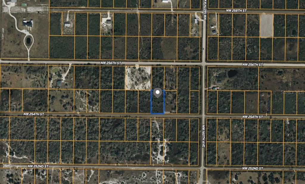 This is an aerial map showing a rectangular plot of land outlined in blue — 16171 NW 254TH STREET, OKEECHOBEE, FL