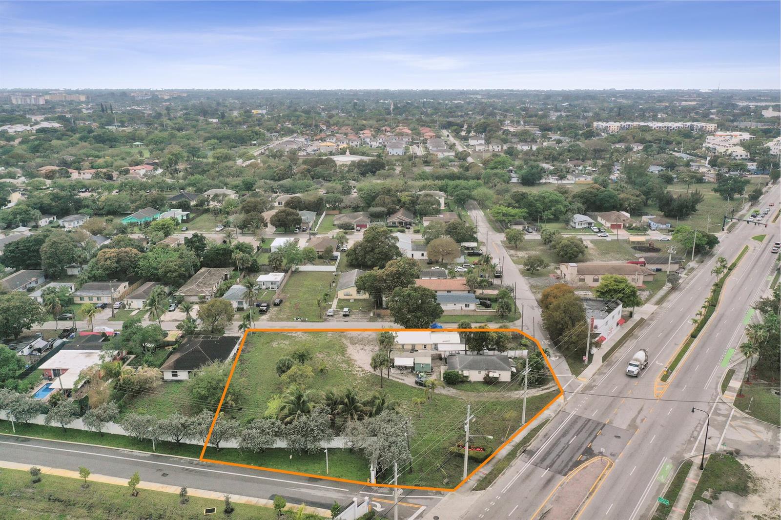 An aerial view shows a large, grassy corner lot with a house and mature trees — 630 NW 15th Avenue, Pompano Beach FL 33069, POMPANO BEACH, FL