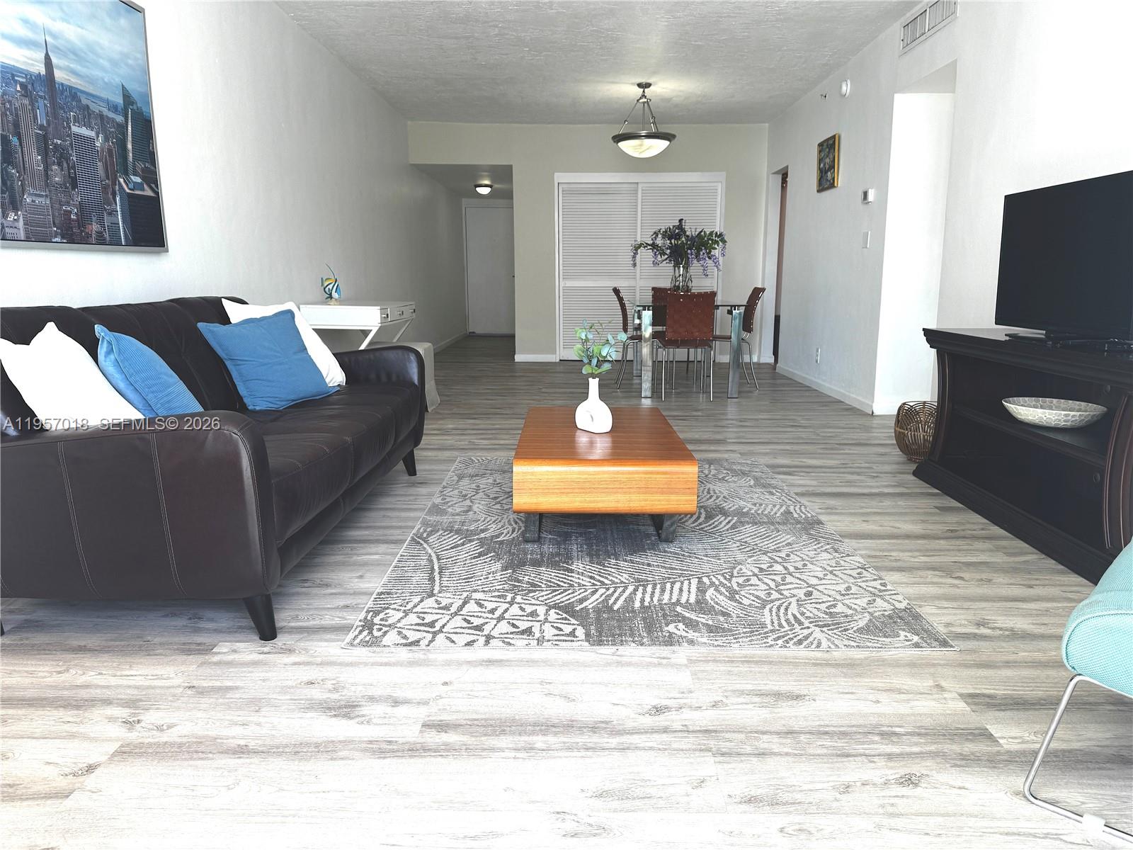 A decorative fish sculpture sits on a white surface in front of a hallway — 3000 S OCEAN DR # 1006, Hollywood FL 33019, HOLLYWOOD, FL
