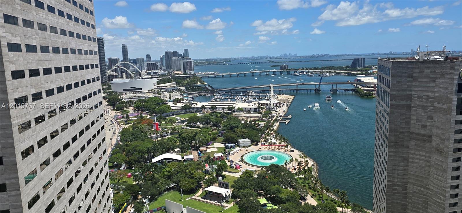 An elevated view shows a city park, a circular fountain, and a bridge over water — 325 S Biscayne Blvd # 4016, Miami FL 33131, MIAMI, FL