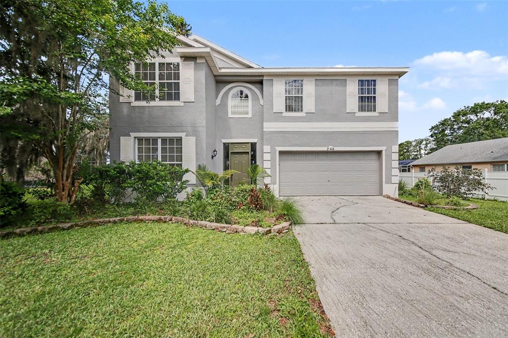 A two-story gray house with a two-car garage and a front lawn — 246 BRIGHTVIEW DRIVE, LAKE MARY, FL
