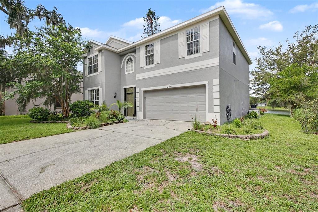 A two-story gray house with a two-car garage and a concrete driveway — 246 BRIGHTVIEW DRIVE, LAKE MARY, FL