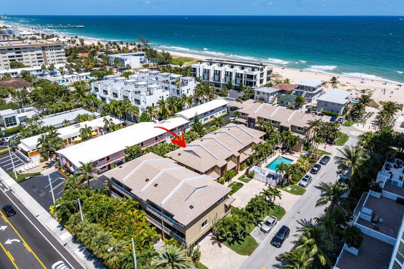 An aerial view shows a multi-story residential complex near a beach and ocean — 3409 SE 8th Street # 6, Pompano Beach FL 33062, POMPANO BEACH, FL