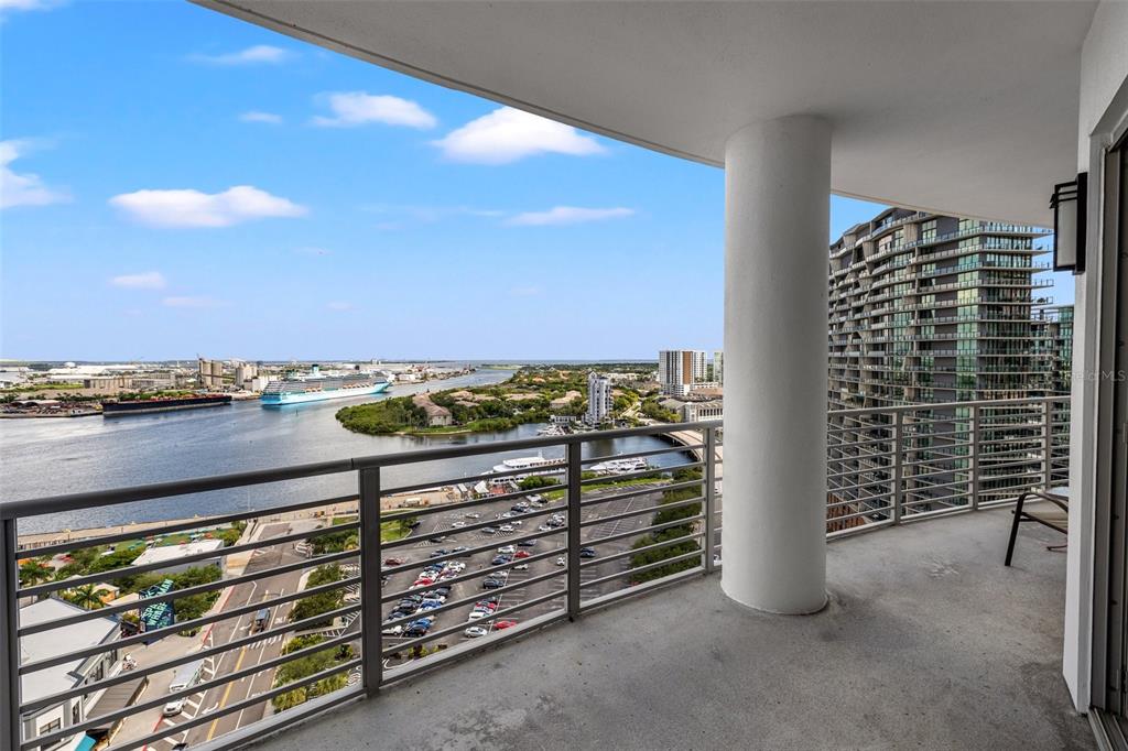 A high-rise balcony overlooks a river, a cruise ship, a parking lot, and city buildings — 449 S 12TH STREET UNIT 1903, TAMPA, FL