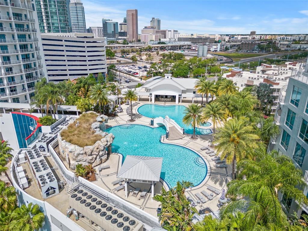 An aerial view of a resort-style swimming pool complex surrounded by high-rise buildings — 449 S 12TH STREET UNIT 1903, TAMPA, FL