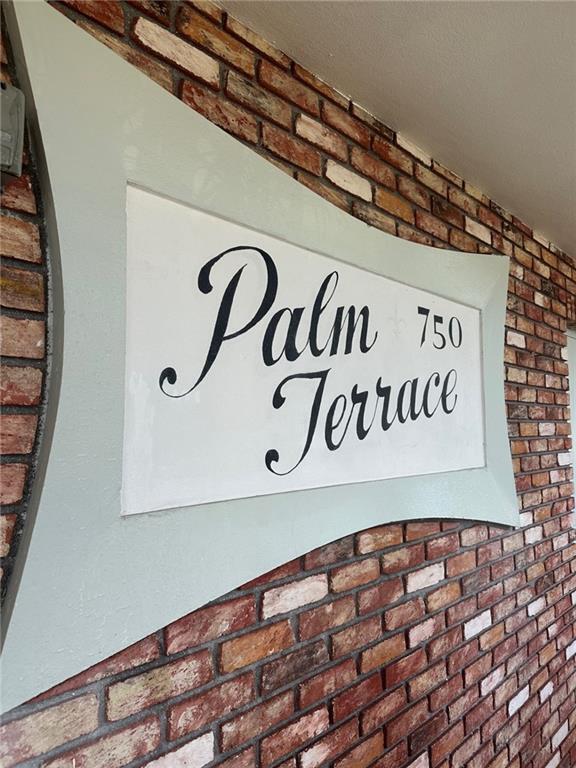 A sign reading Palm Terrace 750 is mounted on a textured brick wall — 750 Pine Drive # 2, Pompano Beach FL 33060, POMPANO BEACH, FL