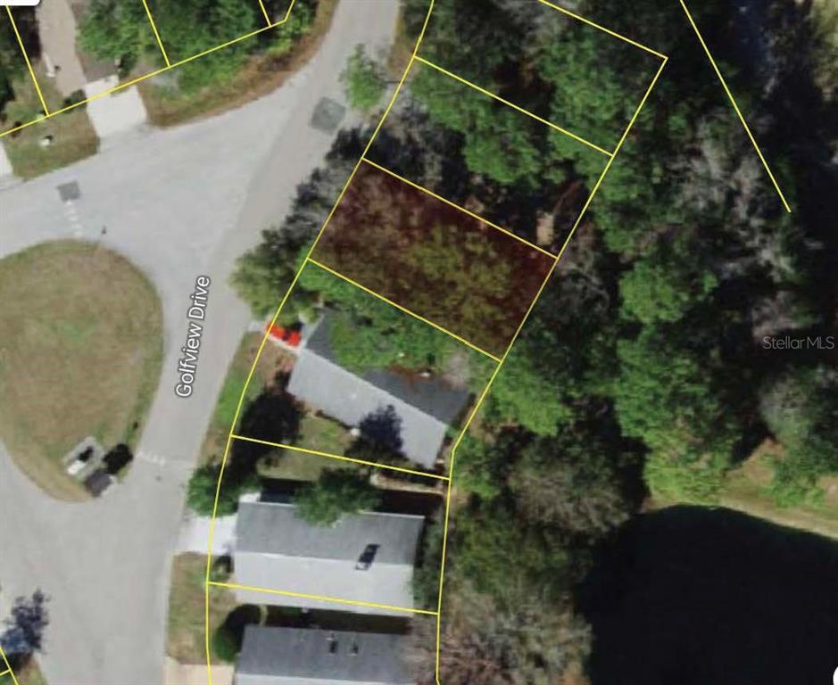 This is an aerial map showing a vacant residential lot highlighted among neighboring houses — 49 GOLFVIEW DRIVE, HOMOSASSA, FL