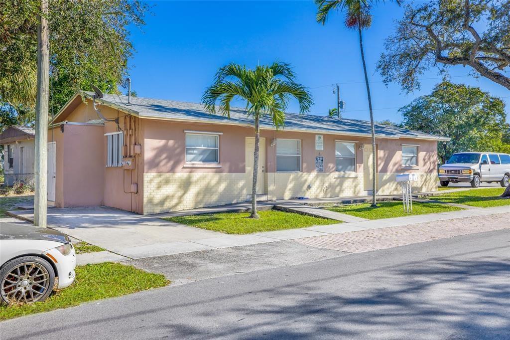 A single-story, multi-unit residential building with a pink and yellow exterior and palm trees — 6 SW 7th Avenue, Dania Beach FL 33004, DANIA BEACH, FL