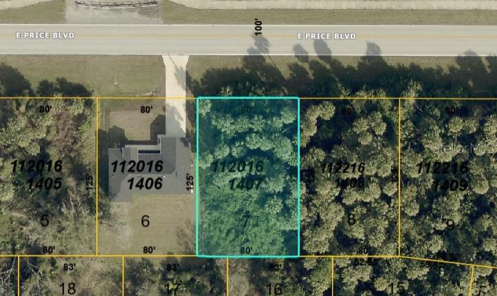 This is an aerial map showing a rectangular, wooded residential lot highlighted in blue — E PRICE BOULEVARD, NORTH PORT, FL
