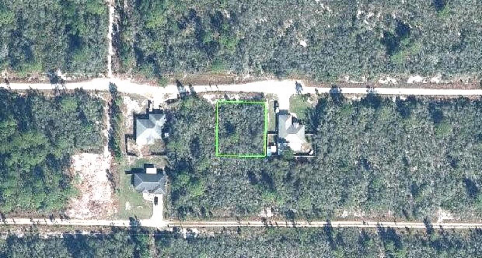An aerial view shows a vacant rectangular lot outlined in green between two existing houses — 224 Brant Avenue, Sebring FL 33870, SEBRING, FL