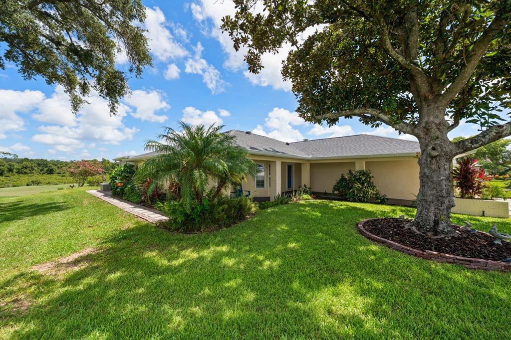 An aerial view of a suburban house with a gray roof and a large backyard — 3495 W LINKS COURT, PALM HARBOR, FL