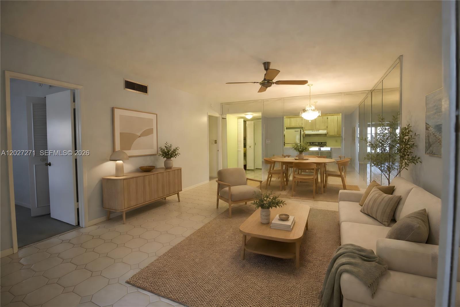 A living room and dining area feature light-colored furniture, a ceiling fan, and mirrored walls — 5621 SW 2nd Ct # 101, Margate FL 33068, MARGATE, FL