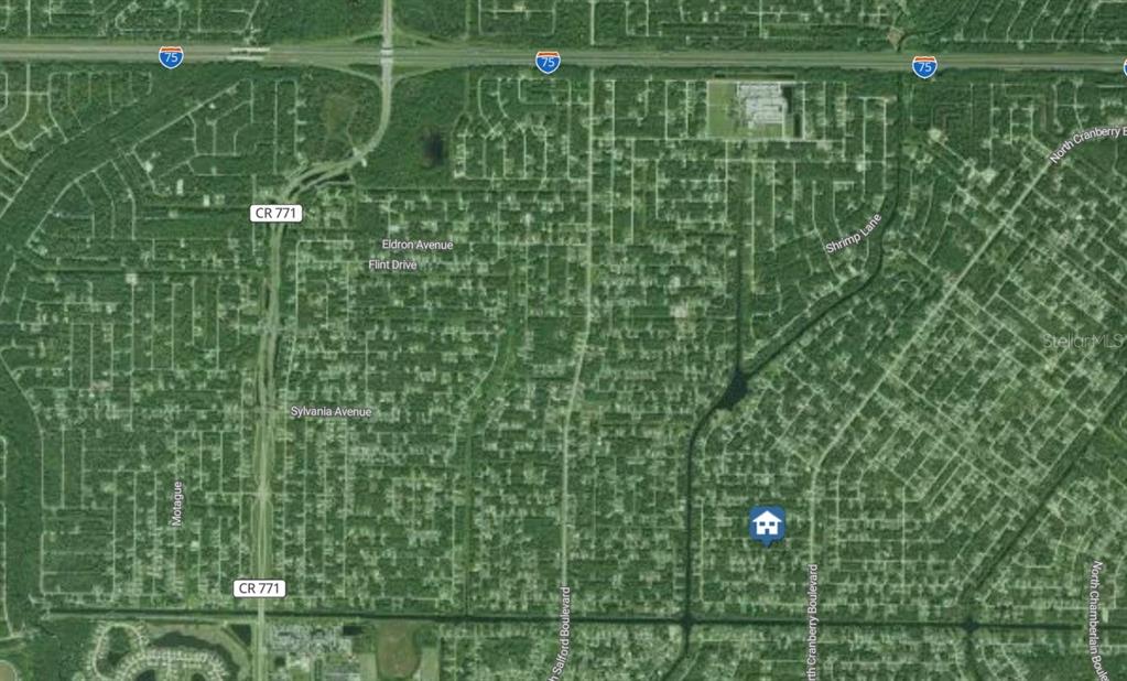 This is an aerial map showing a residential neighborhood with a house icon marker — Lot #12 STOCKTON AVENUE, NORTH PORT, FL