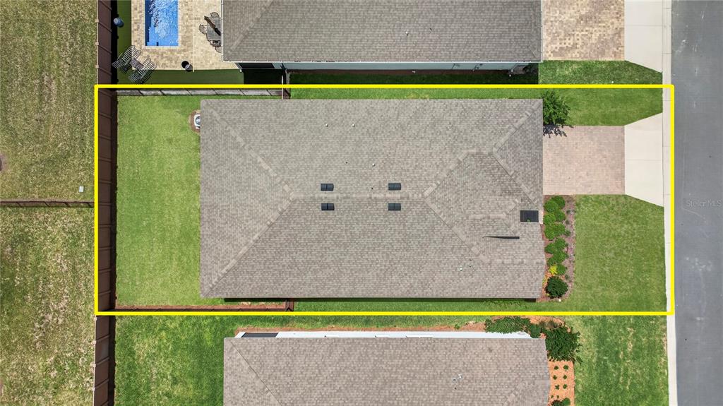 An aerial view shows a single-family house with a shingled roof and a fenced backyard — 4975 NW 39TH LOOP, OCALA, FL