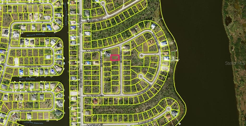 This is an aerial map showing a highlighted vacant residential lot in a suburban neighborhood — 9243 LINGLE STREET, PORT CHARLOTTE, FL