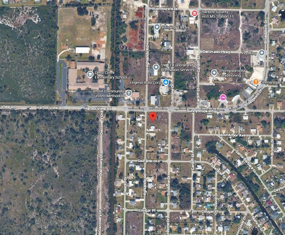 This is an aerial map view of a residential area near Harbor View Road — 3148 HIGHLANDS ROAD, PUNTA GORDA, FL