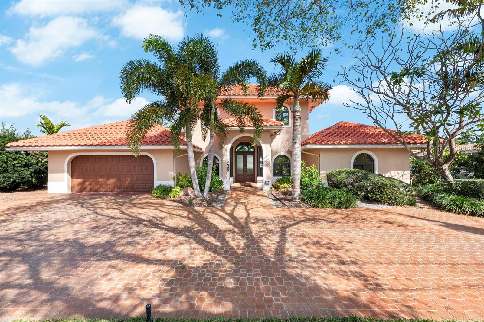 A two-story stucco house with a red tile roof and a brick paver driveway — 2865 NE 19th Street, Pompano Beach FL 33062, POMPANO BEACH, FL