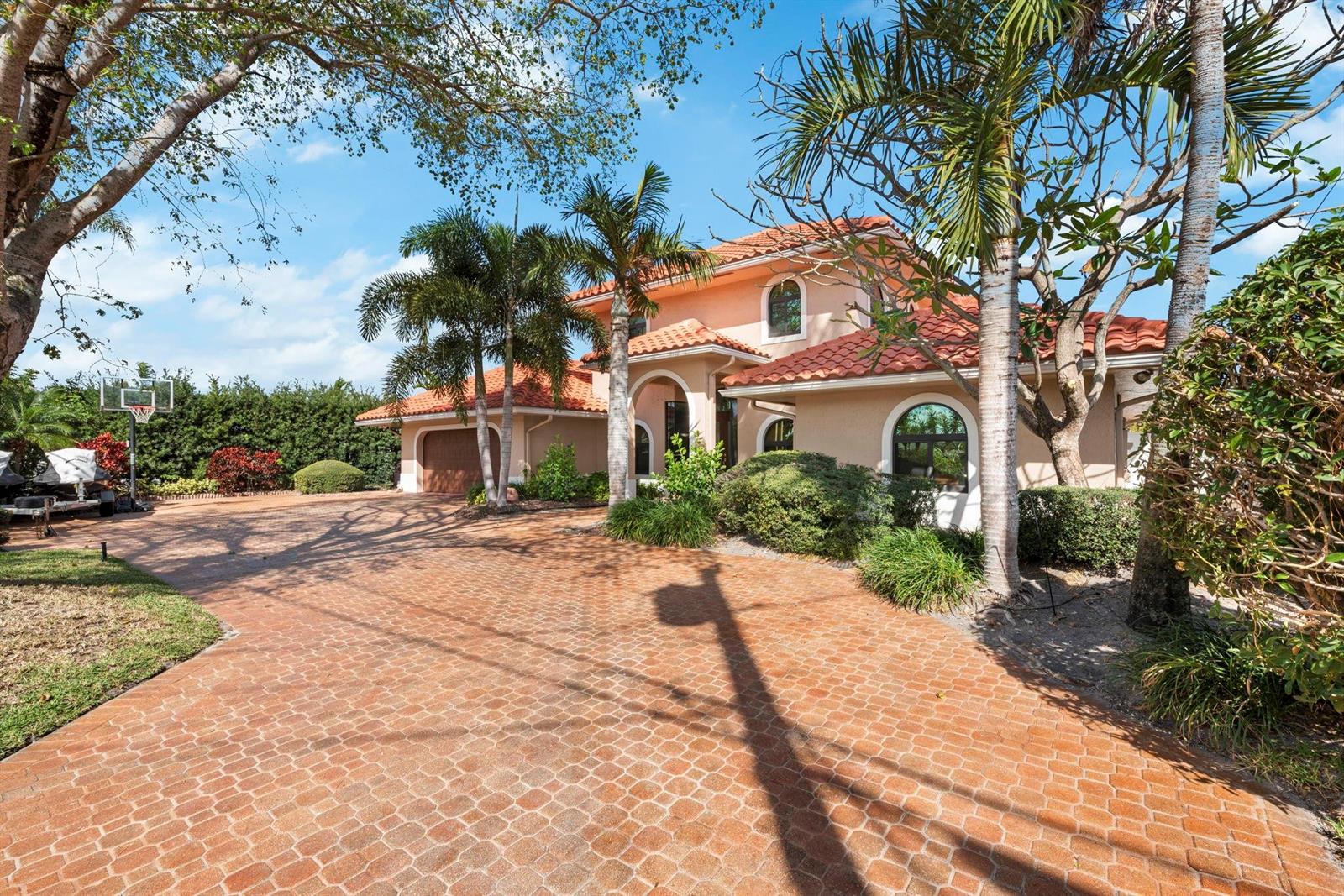 A two-story stucco house with a red tile roof and a large brick-paved driveway — 2865 NE 19th Street, Pompano Beach FL 33062, POMPANO BEACH, FL