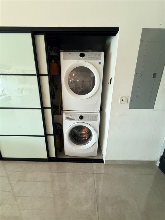A room features a large sliding glass closet door, a grey electrical panel, and tile flooring — 403 DE LA CONSTITUCIÓN AVENUE UNIT 906, SAN JUAN, PR