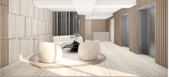 This rendering shows a modern lobby with light wood paneling, two white armchairs, and elevators — 5880 Collins Ave # 302, Miami Beach FL 33140, MIAMI BEACH, FL