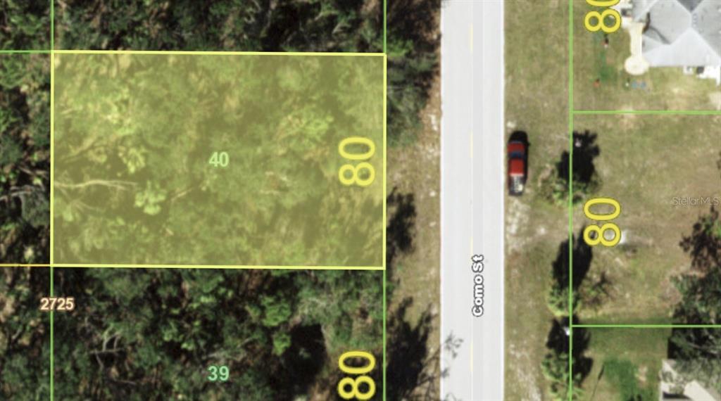 This is a satellite map view showing a rectangular plot of land along a road — 3059 COMO STREET, PORT CHARLOTTE, FL