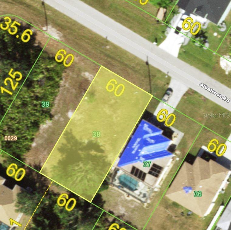 This is an aerial map showing a residential lot highlighted in yellow — 227 ALBATROSS ROAD, ROTONDA WEST, FL