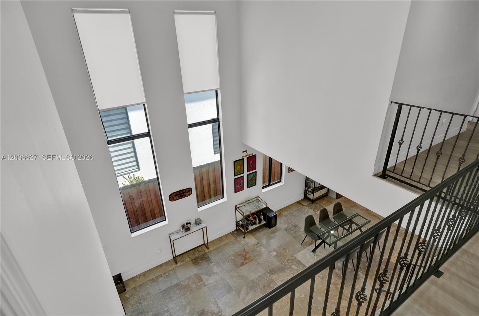 A high-angle view shows a dining area with tile floors, tall windows, and a balcony — 3022 SW 17th St # 3022, Miami FL 33145, MIAMI, FL