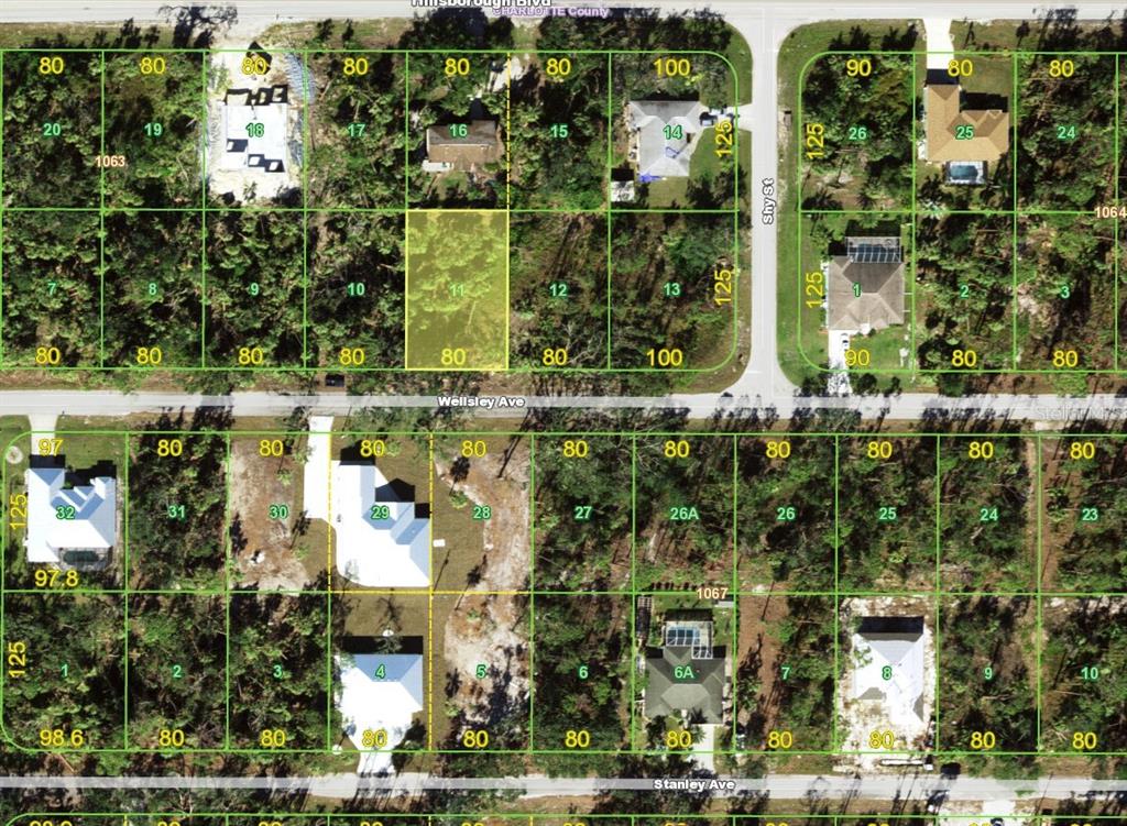 This is an aerial map showing residential lots and streets in a neighborhood — 17394 WELLSLEY AVENUE, PORT CHARLOTTE, FL