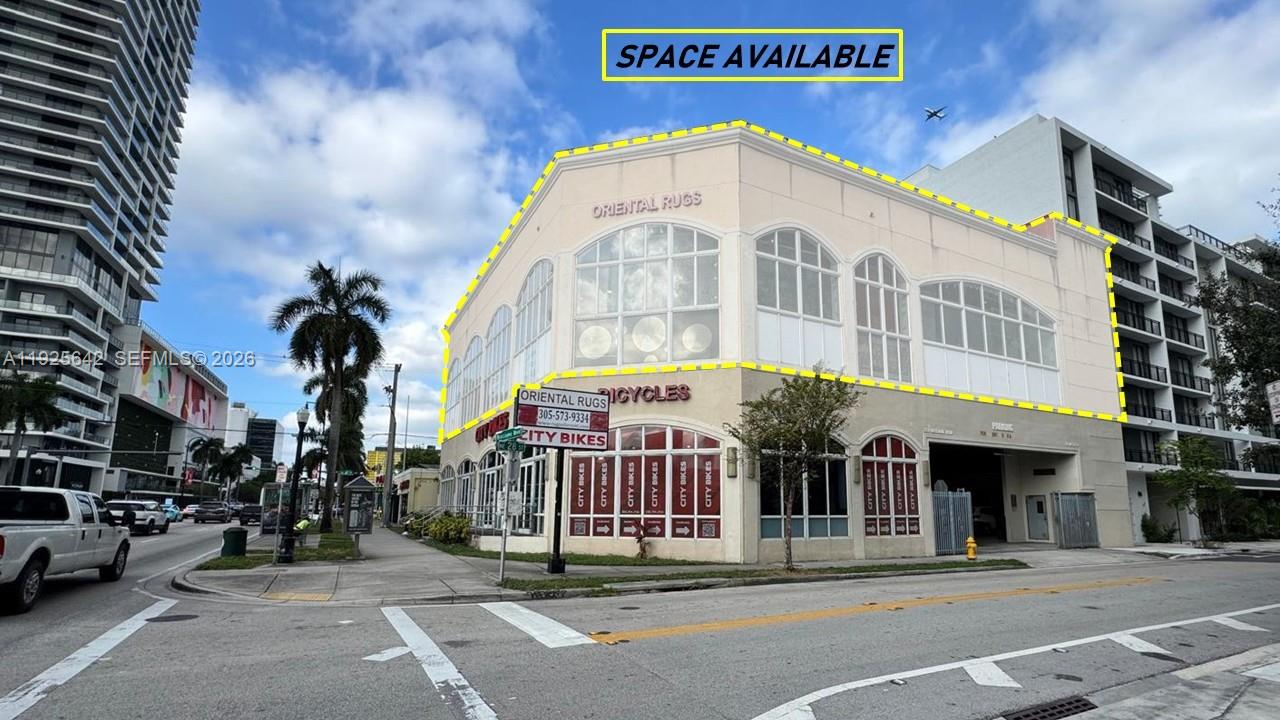 A two-story commercial building with arched windows and a parking entrance on a city street — 2801 BISCAYNE BLVD, Miami FL 33137, MIAMI, FL