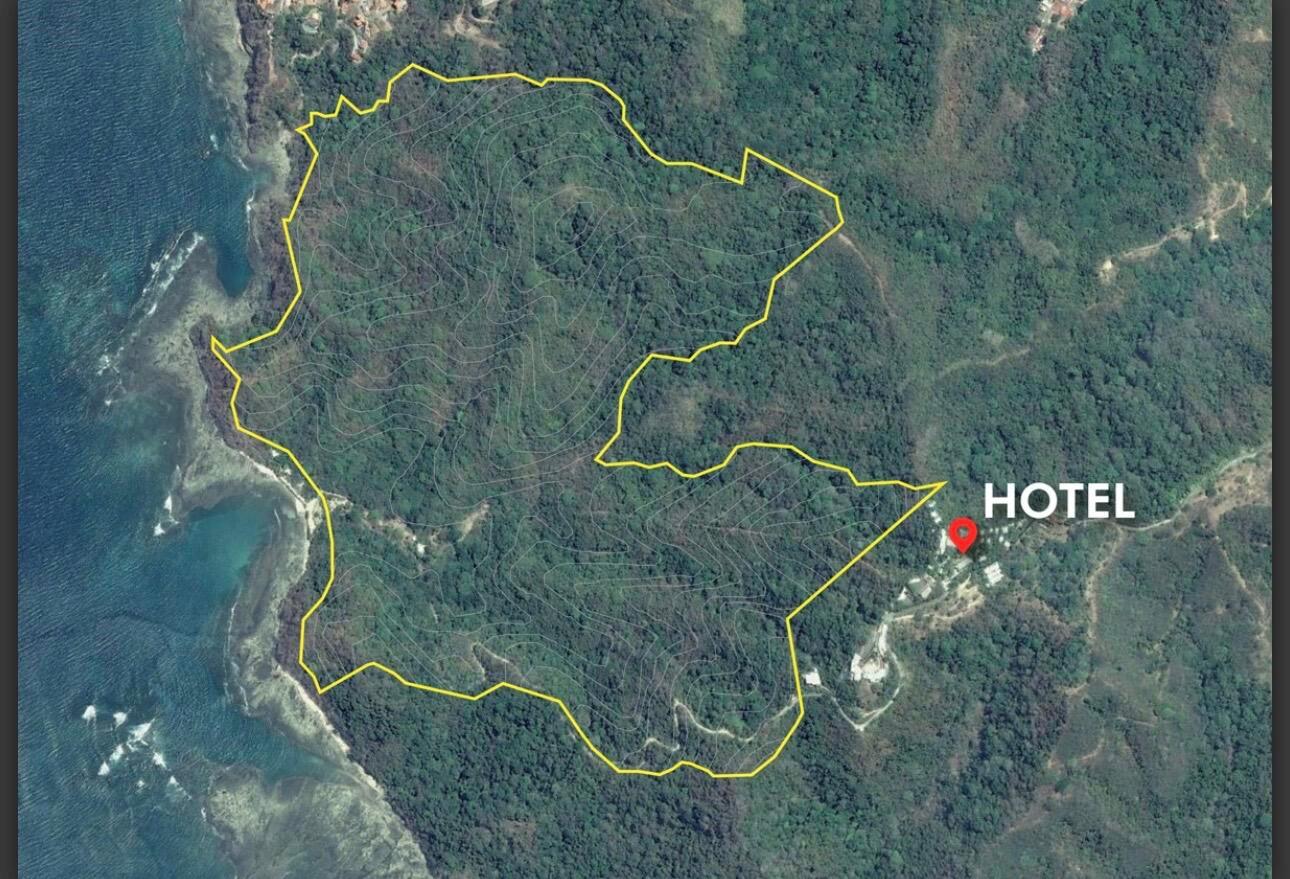 An aerial map shows a large, yellow-outlined plot of land adjacent to a hotel — 0 Playa Caletas, Canton De Garabito, Puntarenas, FL