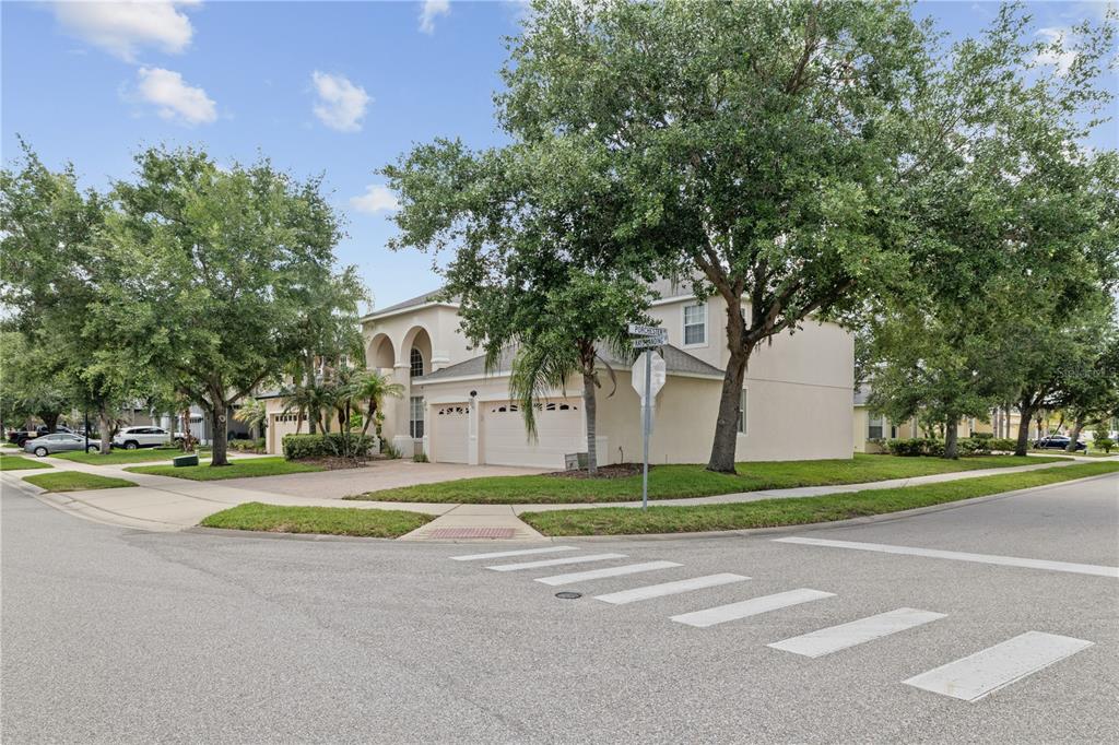 A two-story suburban house with a two-car garage sits on a corner lot — 212 KAYS LANDING DRIVE, SANFORD, FL