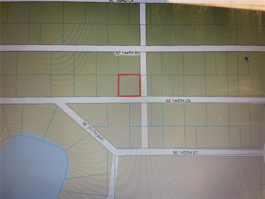This is a map showing a highlighted rectangular property lot near several local roads — 21139 SE 144TH LANE, UMATILLA, FL