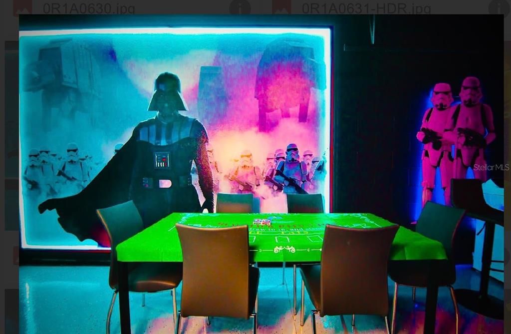 A game room features a Star Wars-themed wall mural, a green card table, and chairs — 3029 MAHALO DRIVE, DAVENPORT, FL