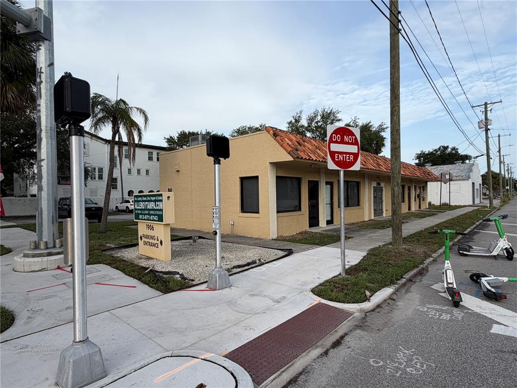 A single-story commercial building with a tan stucco exterior and a red tile roof — 1906 W PLATT STREET, TAMPA, FL