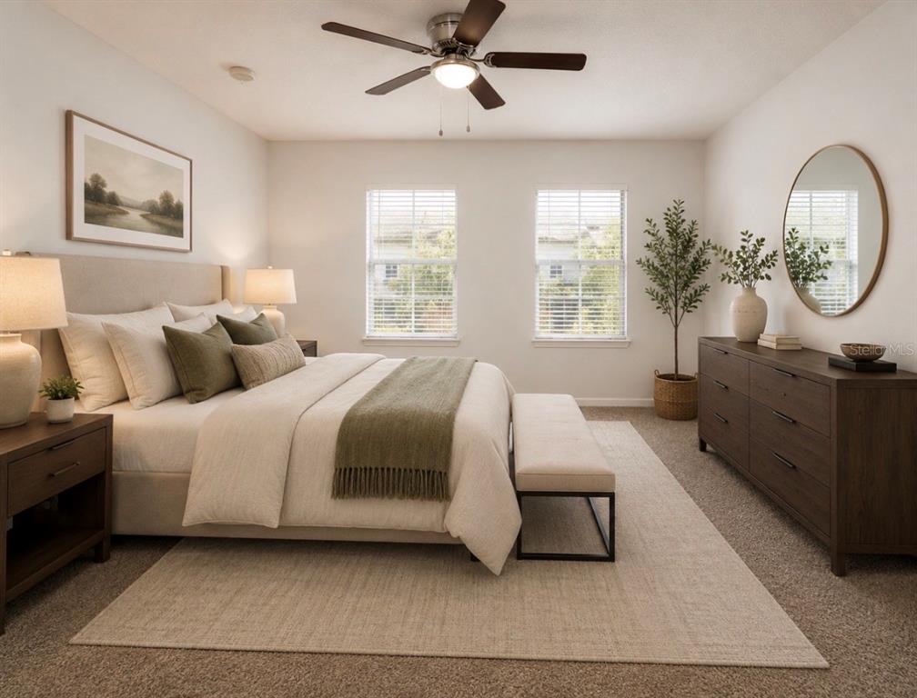 A bedroom features a bed with neutral bedding, a wooden dresser, and a ceiling fan — 7818 BALLY MONEY ROAD, TAMPA, FL