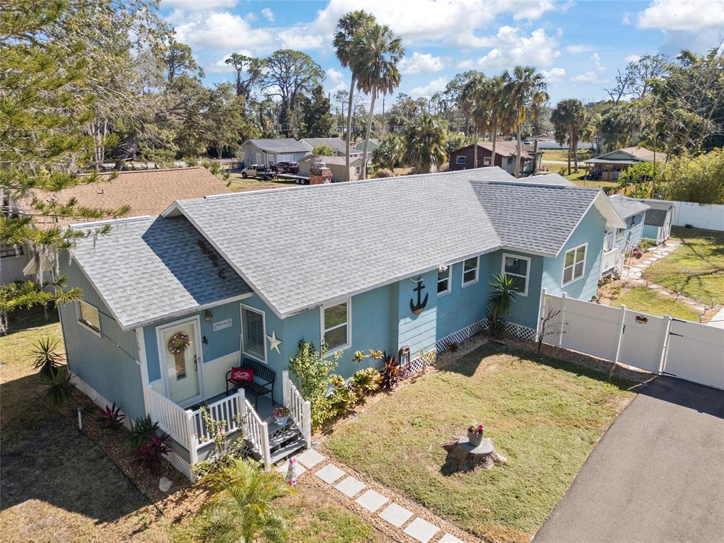 An aerial view of a light blue house with a gray roof and white trim — 5150 LIMESTONE DRIVE, PORT RICHEY, FL