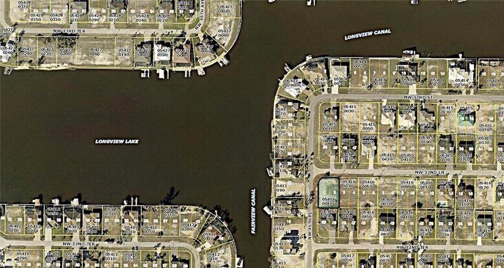 This is an aerial map showing residential lots, canals, and a lake — 4430 NW 32ND LANE, CAPE CORAL, FL