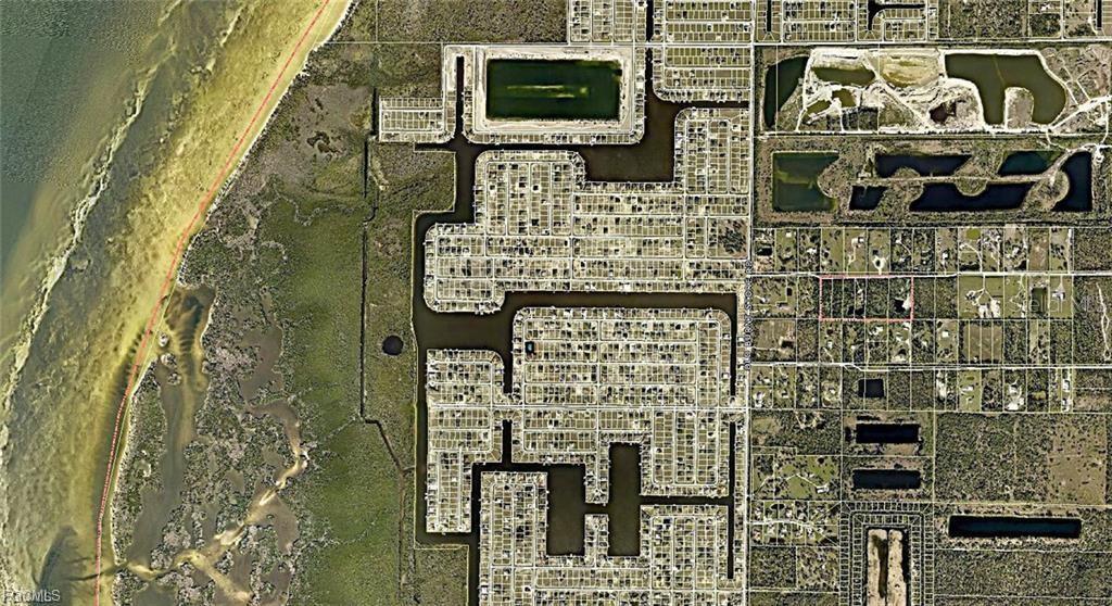 This aerial map shows a residential neighborhood with canal systems adjacent to a coastal area — 4430 NW 32ND LANE, CAPE CORAL, FL