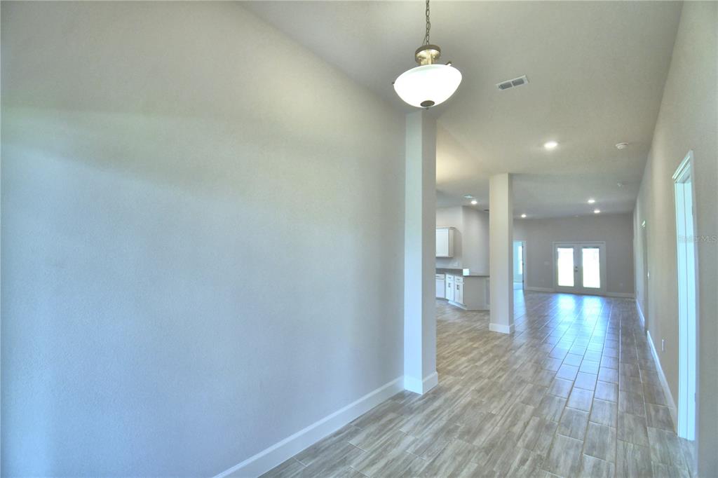 A light blue single-story house with a tile roof and a concrete driveway — 4705 GRANDVIEW GLEN DRIVE, AUBURNDALE, FL