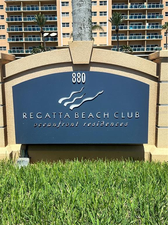 A sign for the Regatta Beach Club stands in front of a large residential building — 880 MANDALAY AVENUE UNIT 309, CLEARWATER, FL