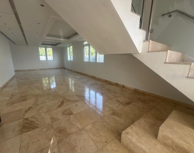 An interior view of a room with polished stone floors, white walls, and a staircase — 1124 MANSIONES DE VISTAMAR MARINA III, CAROLINA, PR