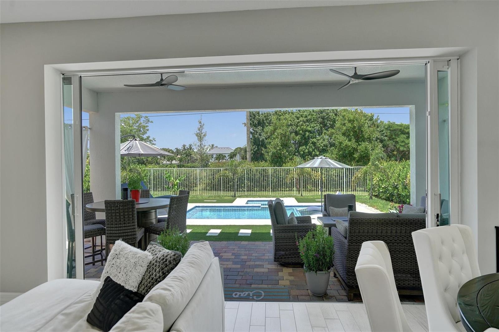 A two-story house with a stone facade, a two-car garage, and palm trees in front — 9621 Mosler Trail, Lake Worth FL 33467, LAKE WORTH, FL